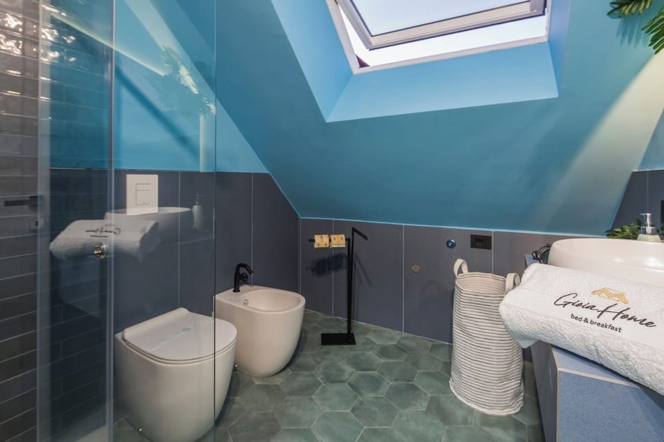 Family Quadruple Room | Bathroom | Hair dryer, slippers, towels, soap