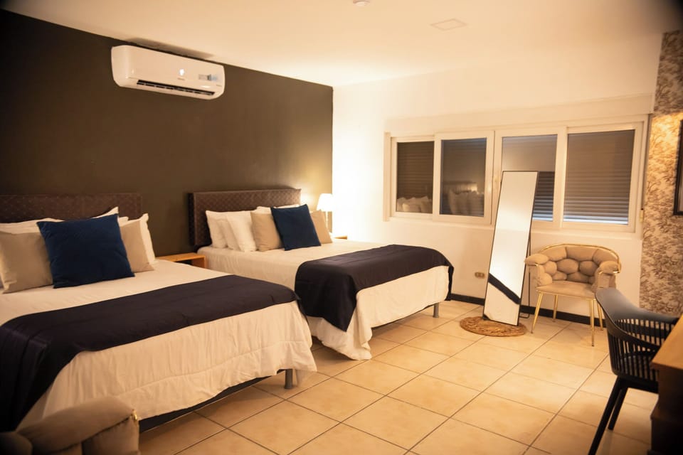 Family Double Room, City View | Down comforters, desk, laptop workspace, blackout drapes