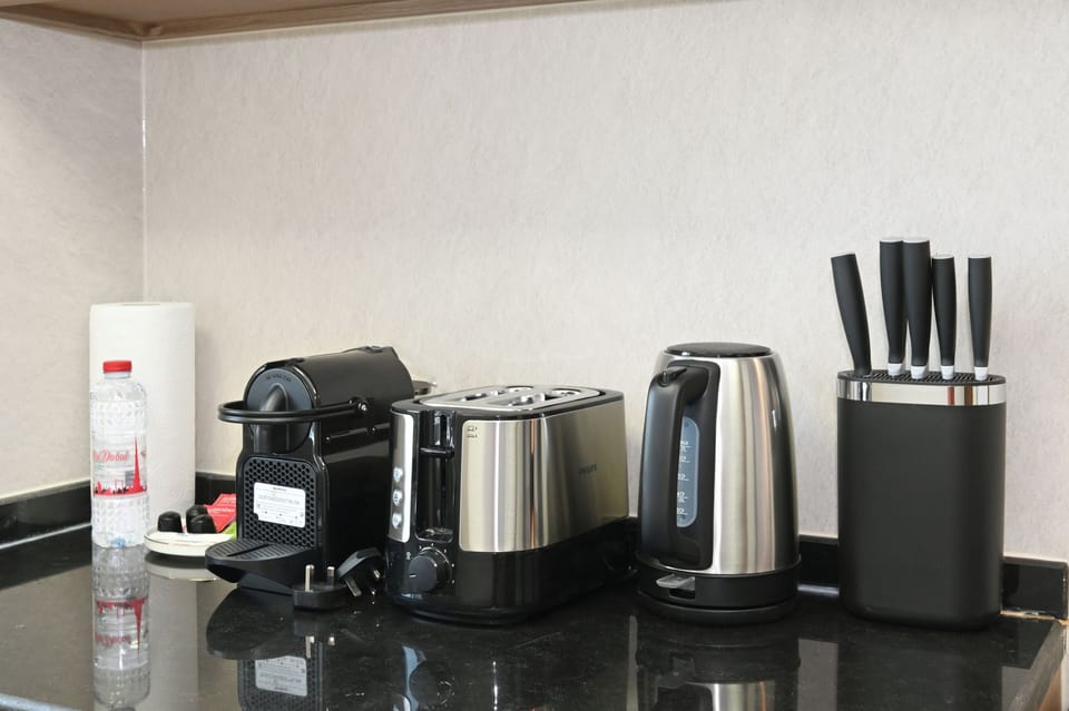 Apartment, Balcony, City View | Coffee and/or coffee maker