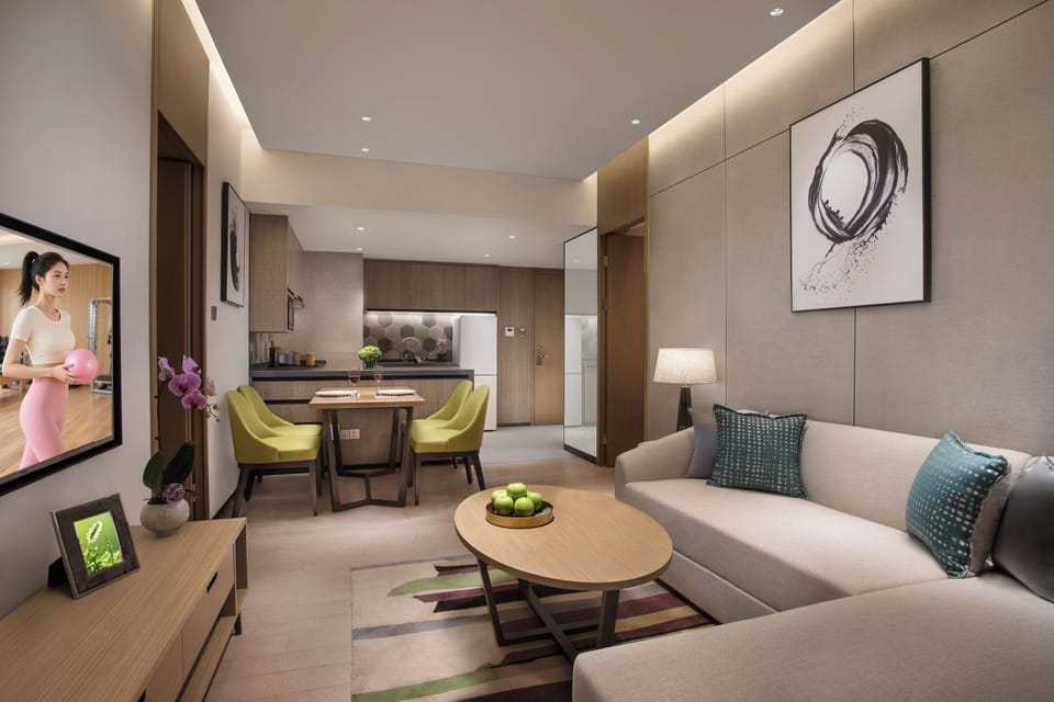 Premier Suite, City View | Living area | 60-inch Smart TV with digital channels