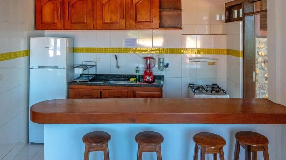 Bungalow, Sea View | Private kitchen | Fridge, oven, cookware/dishes/utensils, dining table