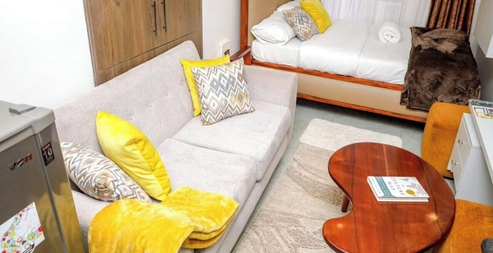 Deluxe Studio, City View | Living area | 32-inch Smart TV with digital channels