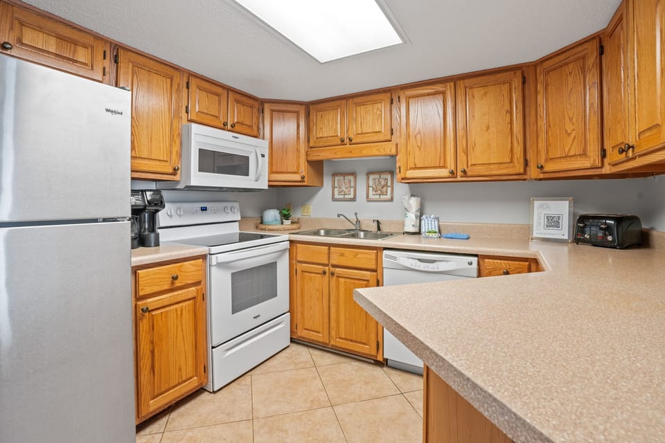 Condo, 2 Bedrooms | Private kitchen | Coffee/tea maker, fridge, oven