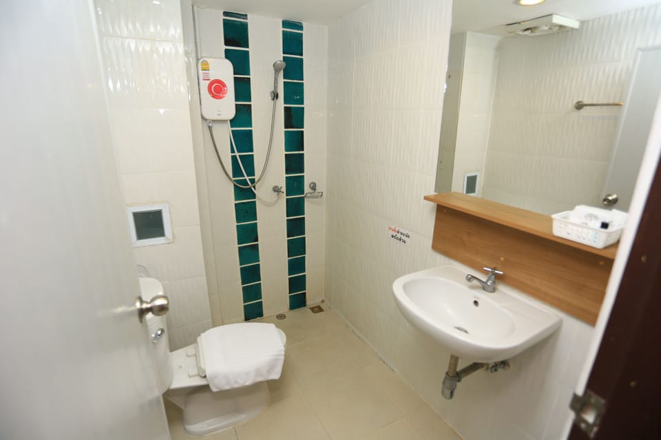 Shower, free toiletries, slippers, towels