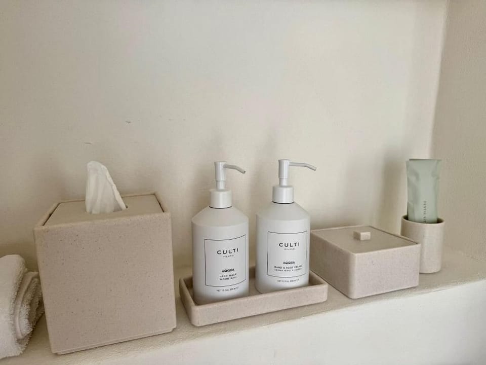 Deluxe Double Room, Patio, Garden View | Bathroom amenities | Separate tub and shower, hair dryer, slippers, towels