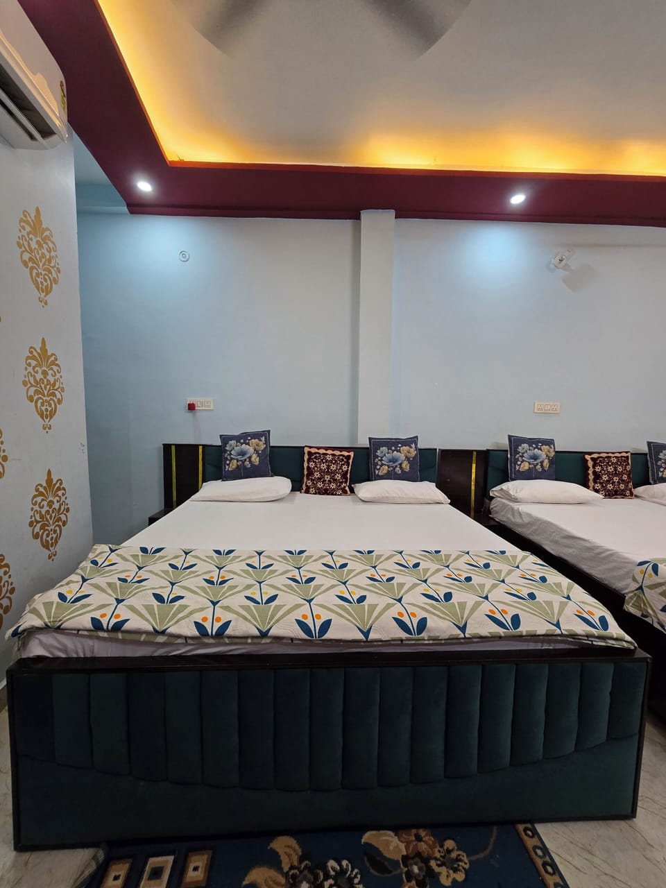 Deluxe Quadruple Room | In-room safe, desk, laptop workspace, iron/ironing board
