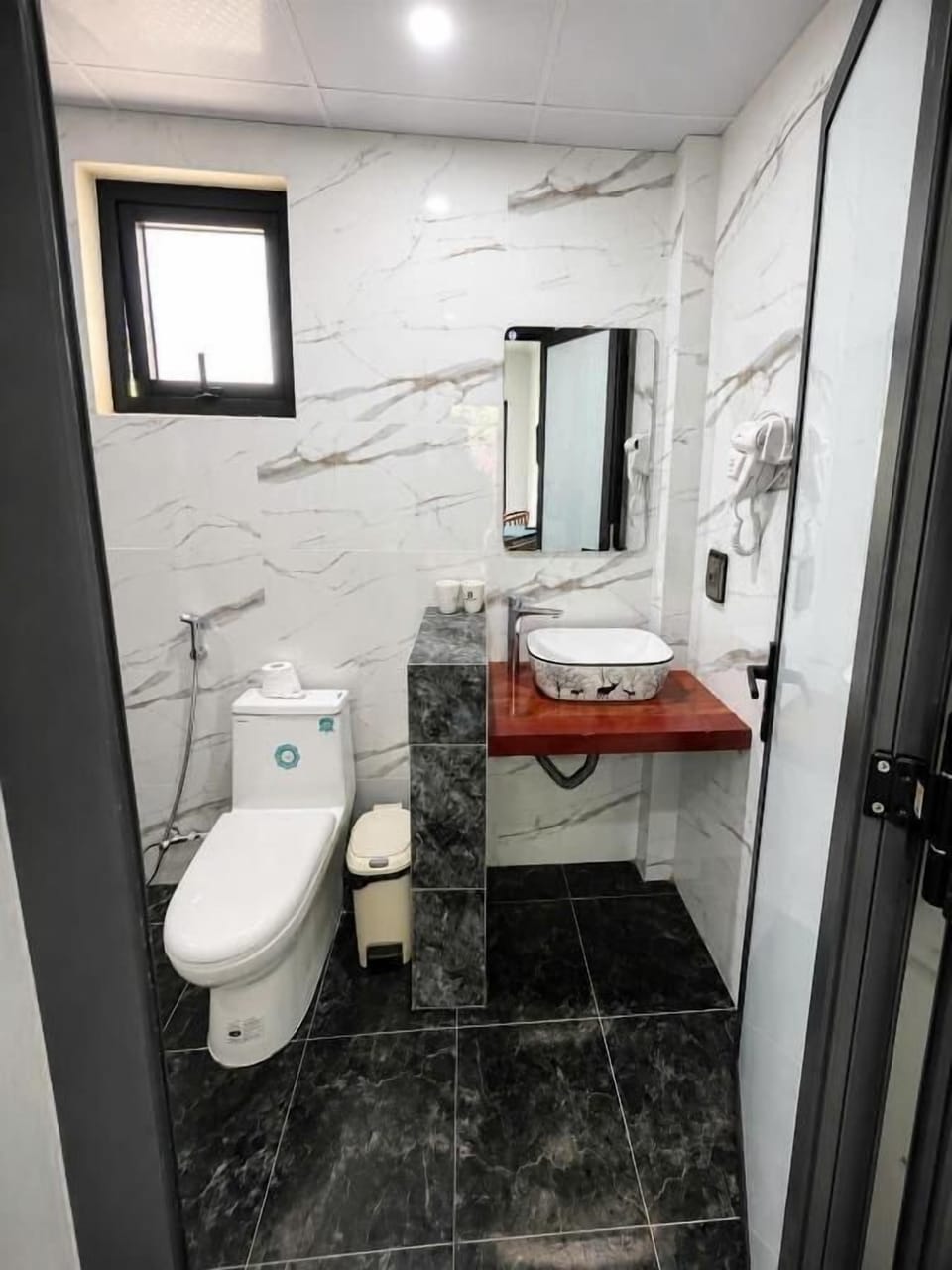 Shower, hair dryer, slippers, towels