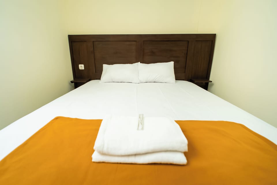 Standard Double Room | Desk, bed sheets