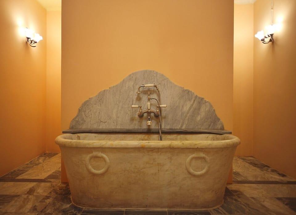 Grand Suite, 1 King Bed, Garden View | Bathroom | Separate tub and shower, free toiletries, hair dryer, towels