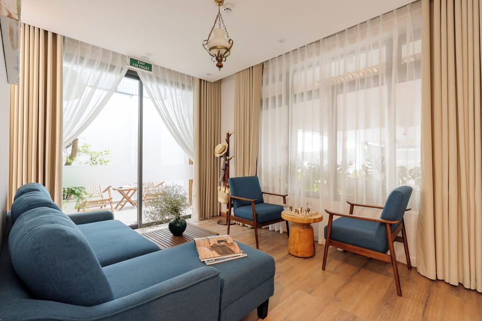 Signature Suite, Balcony, Garden View | Living area | Flat-screen TV