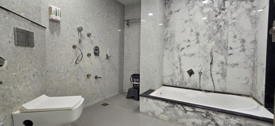 Suite, City View | Bathroom | Hair dryer, towels, soap, shampoo