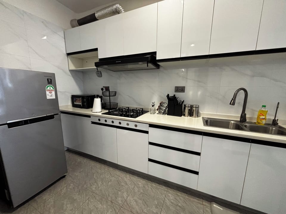 Apartment, 2 Bedrooms, Courtyard View | Private kitchen | Rice cooker, blender, cleaning supplies, freezer