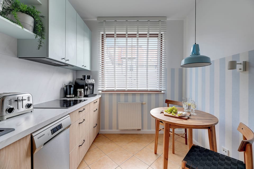 Family Apartment, Balcony | Private kitchen | Coffee/tea maker, microwave, electric kettle, toaster