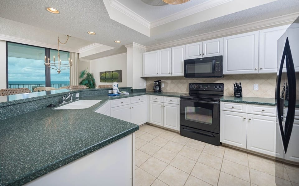 Condo, 2 Bedrooms | Private kitchen | Coffee/tea maker, fridge, oven
