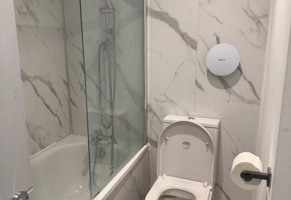 Shower, deep soaking tub, hair dryer, towels