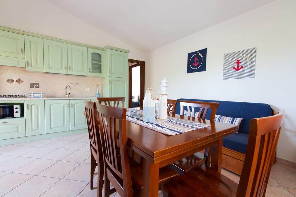 Apartment, 2 Bedrooms (Trilocale Boutique) | Private kitchen | Full-size fridge, microwave, stovetop, dishwasher