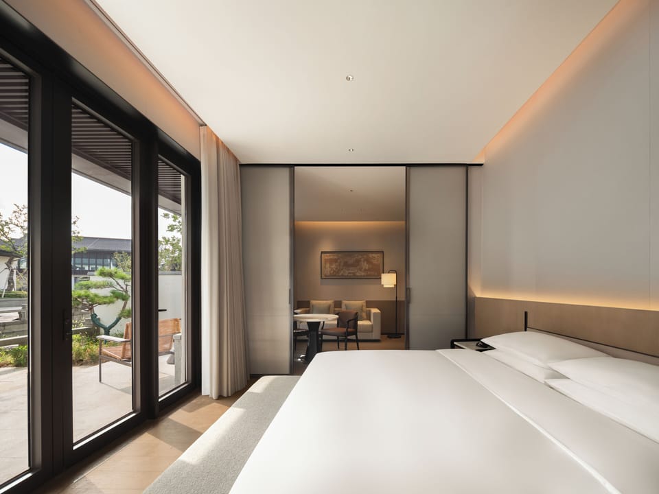 Deluxe Queen Suite | In-room safe, blackout drapes, iron/ironing board (on request)