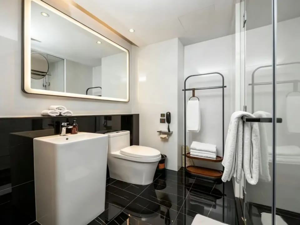 Family Triple Room | Bathroom | Shower, free toiletries, hair dryer, slippers