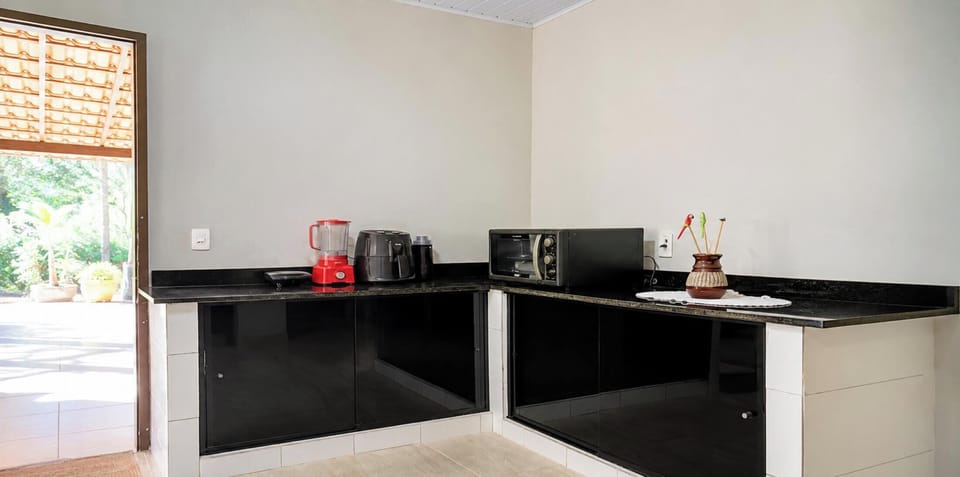 Chalet | Private kitchen | Fridge, microwave, cookware/dishes/utensils, dining table