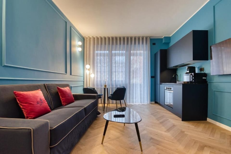 Deluxe Apartment, Balcony, City View | Living area | 50-inch Smart TV with cable channels