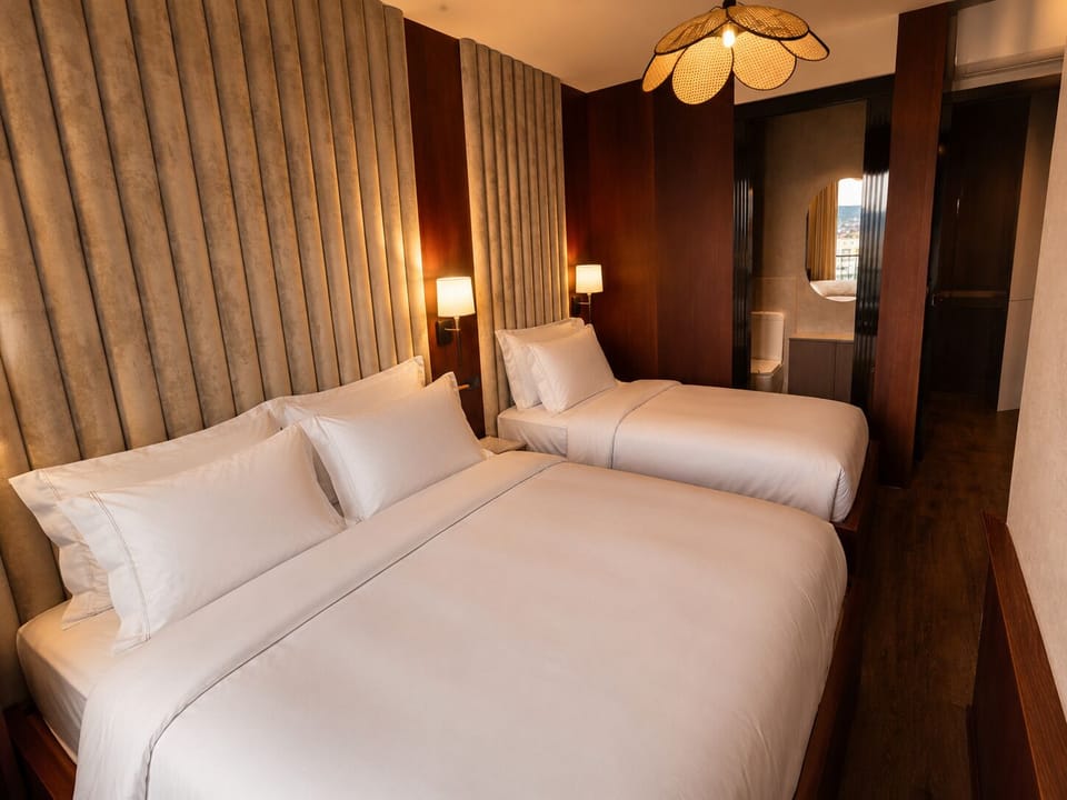 Deluxe Triple Room, City View | Premium bedding, Tempur-Pedic beds, in-room safe, blackout drapes
