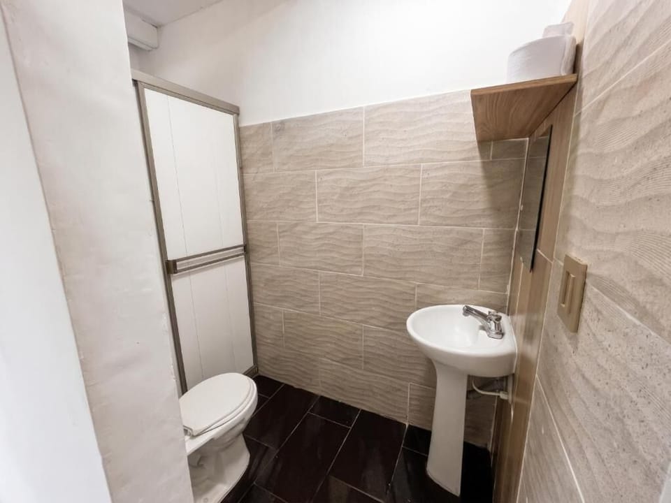 Shower, towels, soap, toilet paper