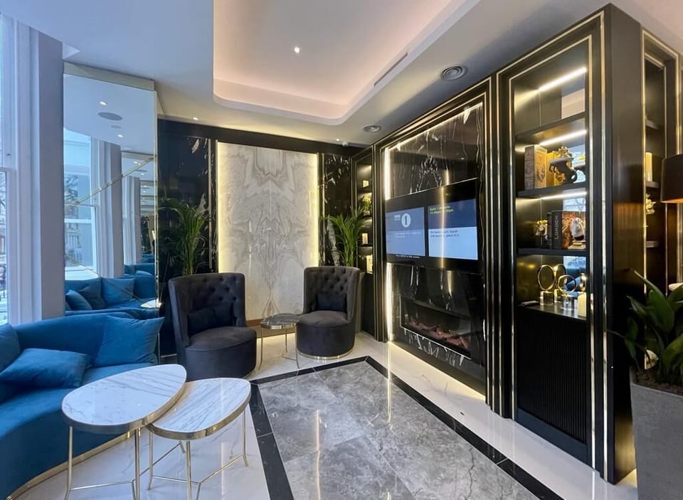 Quadruple Room | Living area | Flat-screen TV