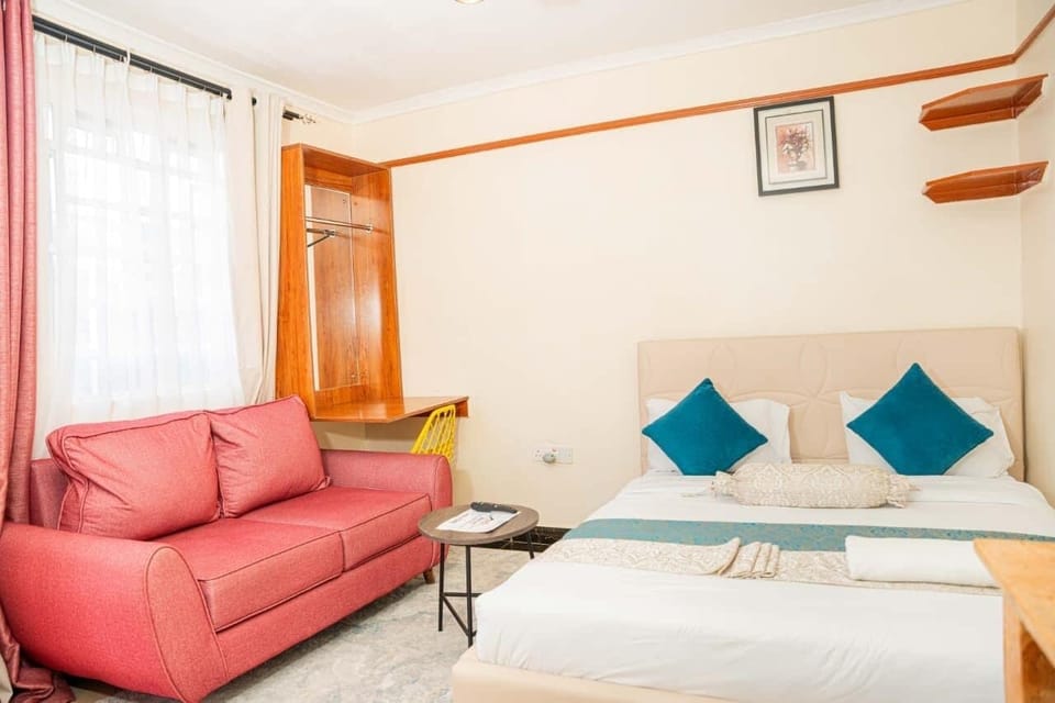 Deluxe Studio Suite | Living area | 32-inch Smart TV with digital channels