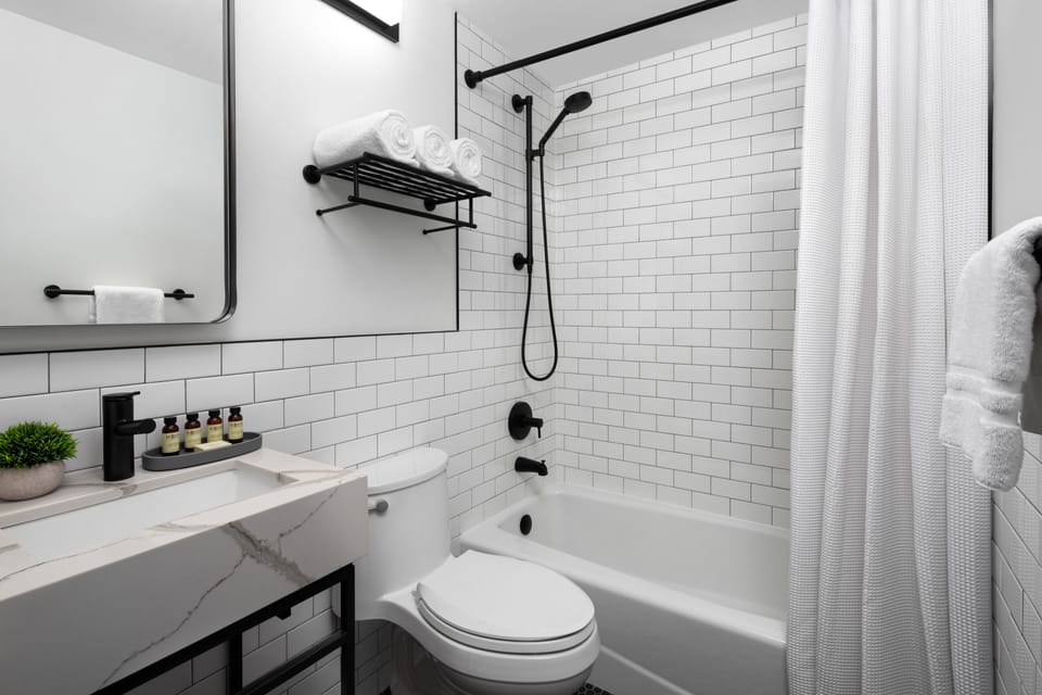 Combined shower/tub, free toiletries, hair dryer, slippers