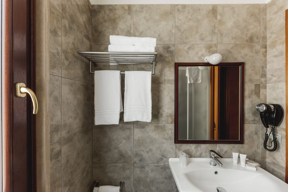 Classic Room | Bathroom | Bathtub, free toiletries, hair dryer, bathrobes