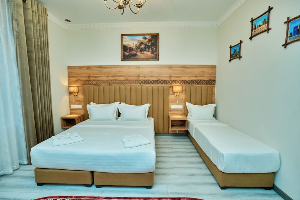 Family Triple Room, Balcony | In-room safe, desk, laptop workspace, soundproofing