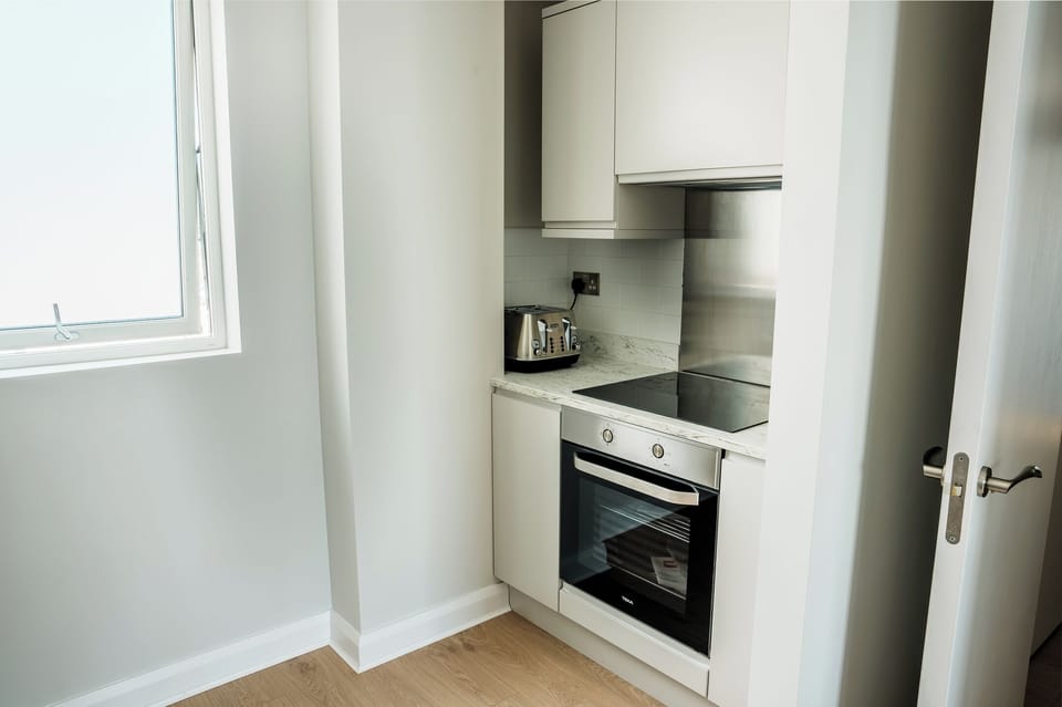 Family Apartment, Balcony, Sea View | Private kitchen | Highchair