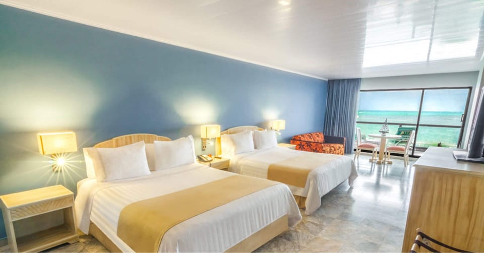 Standard Triple Room, Sea View | Premium bedding, down comforters, minibar, in-room safe