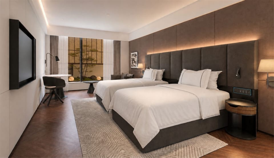 Deluxe Twin Room, Courtyard View | In-room safe, desk, laptop workspace, blackout drapes