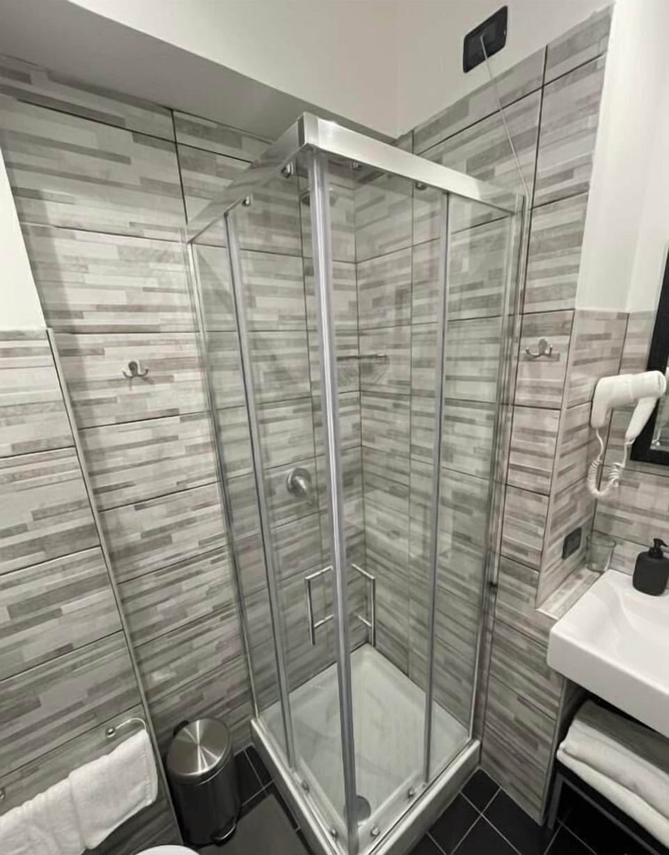 Shower, free toiletries, hair dryer, slippers
