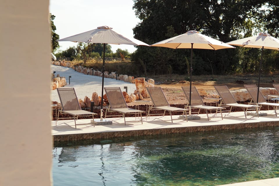 Seasonal outdoor pool, open 10:30 AM to 7:30 PM, pool umbrellas
