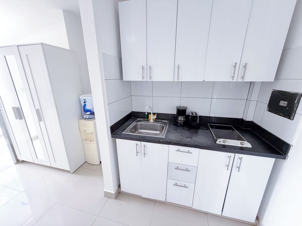 Deluxe Studio, Pool View | Private kitchen | Coffee/tea maker, fridge, microwave, stovetop