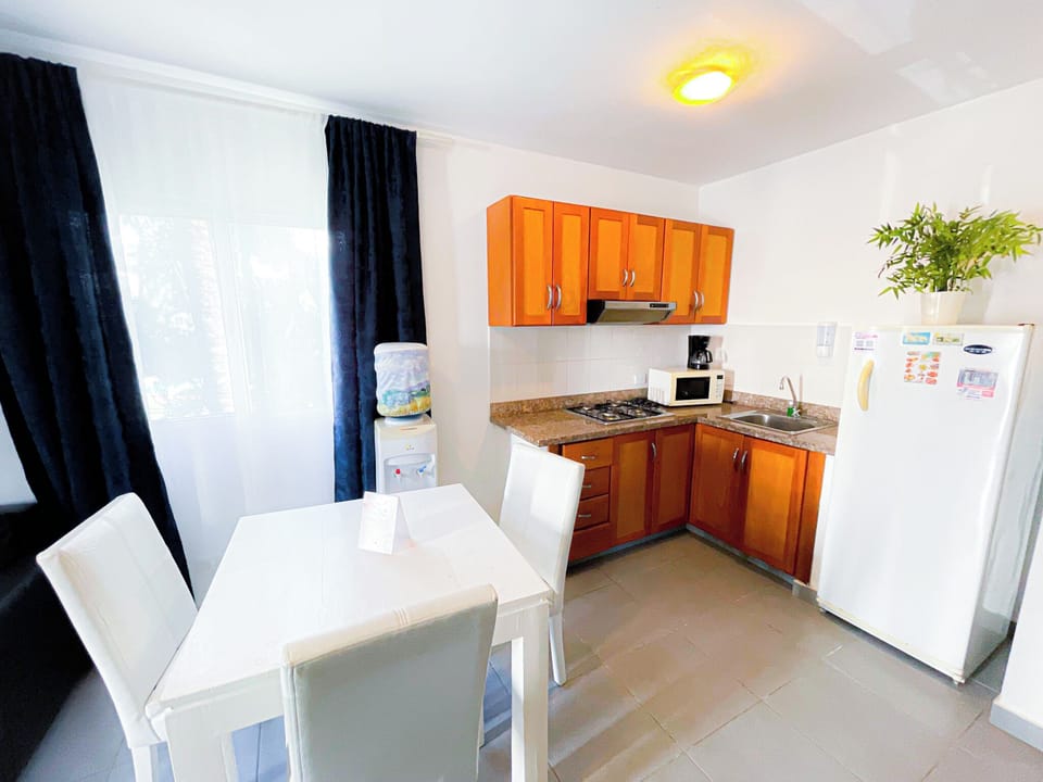 Comfort Suite, 1 Bedroom, Garden View | Private kitchen | Coffee/tea maker, fridge, microwave, stovetop