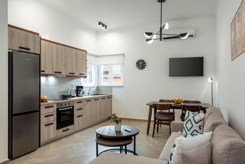 Comfort Apartment | Living area | 50-inch Smart TV with cable channels