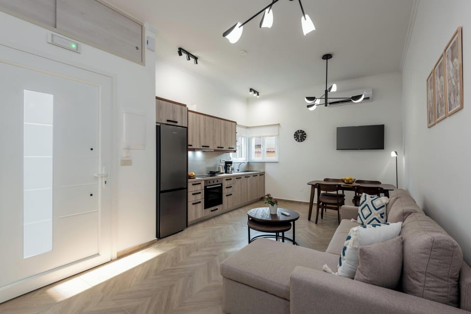 Comfort Apartment | Living area | 50-inch Smart TV with cable channels