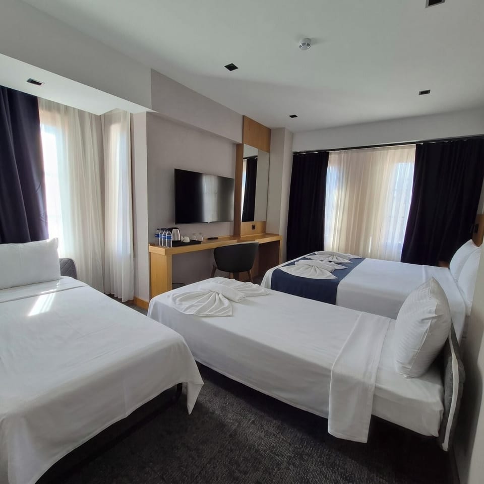 Family Quadruple Room, City View | Minibar, in-room safe, laptop workspace, WiFi (free)