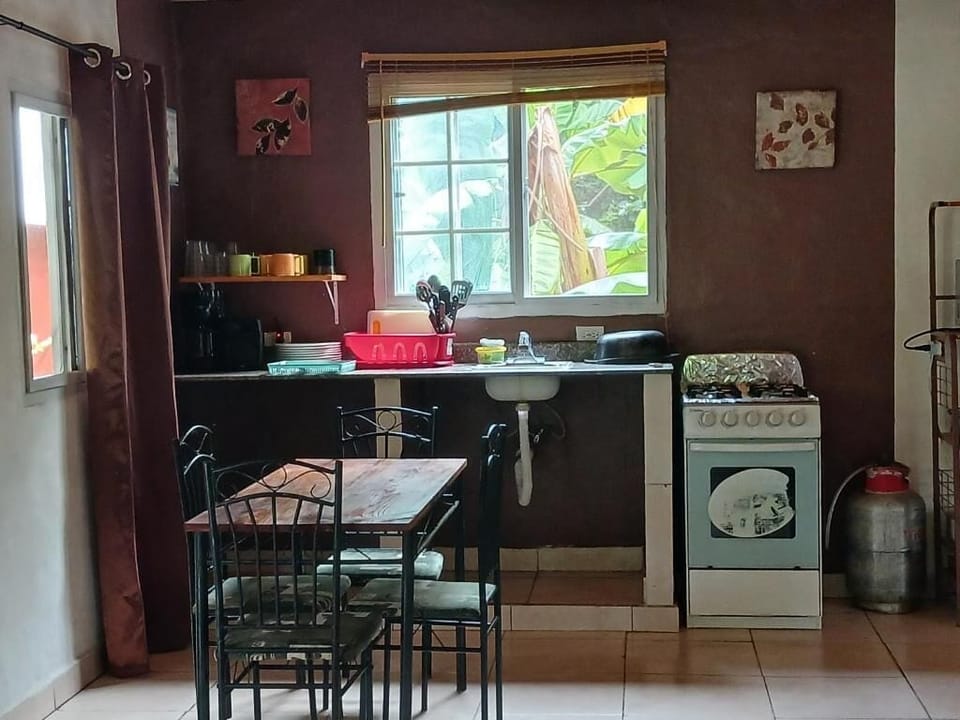 Economy Studio Suite, Pool View | Private kitchen | Coffee/tea maker, full-size fridge, microwave, oven