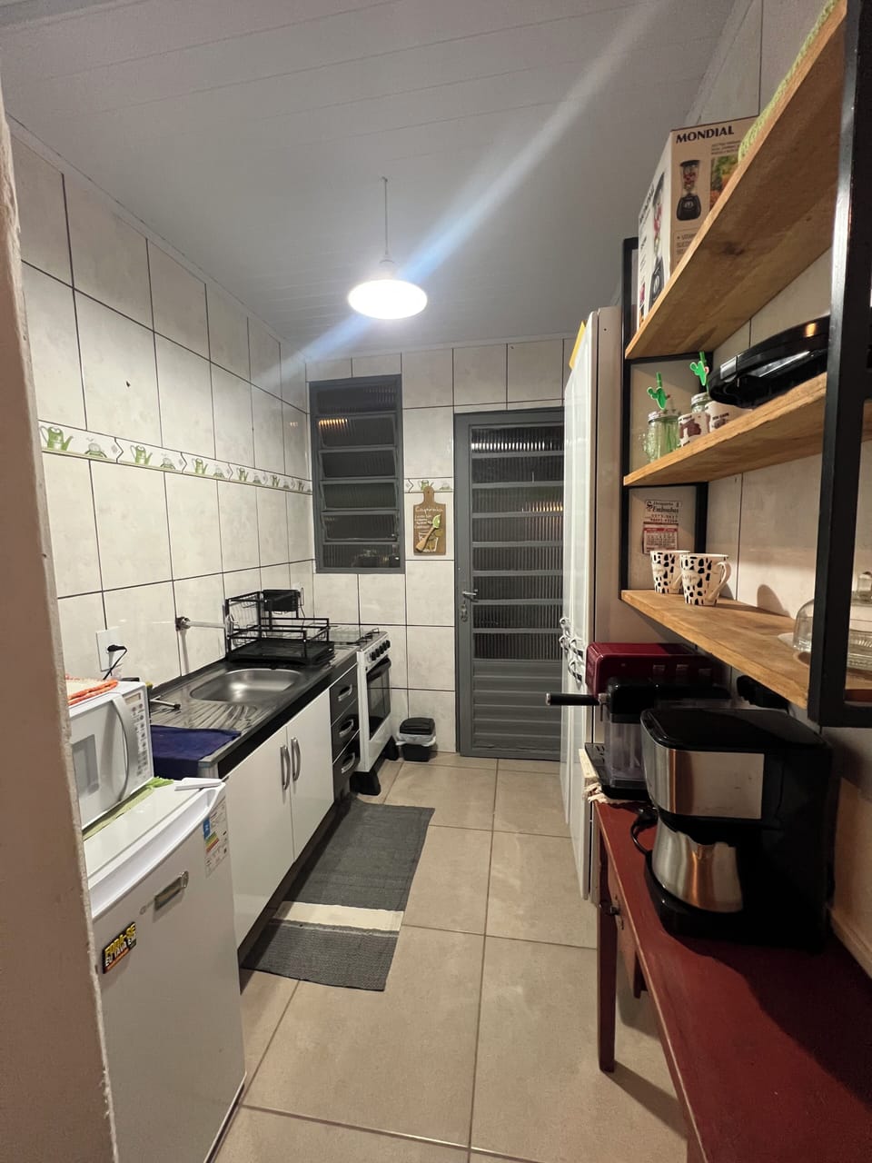 Mini-fridge, microwave, stovetop, cookware/dishes/utensils