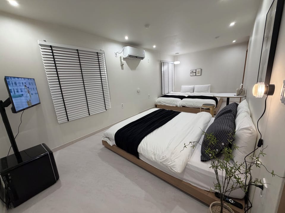 Family Triple Room | Hypo-allergenic bedding available, minibar (free items), desk