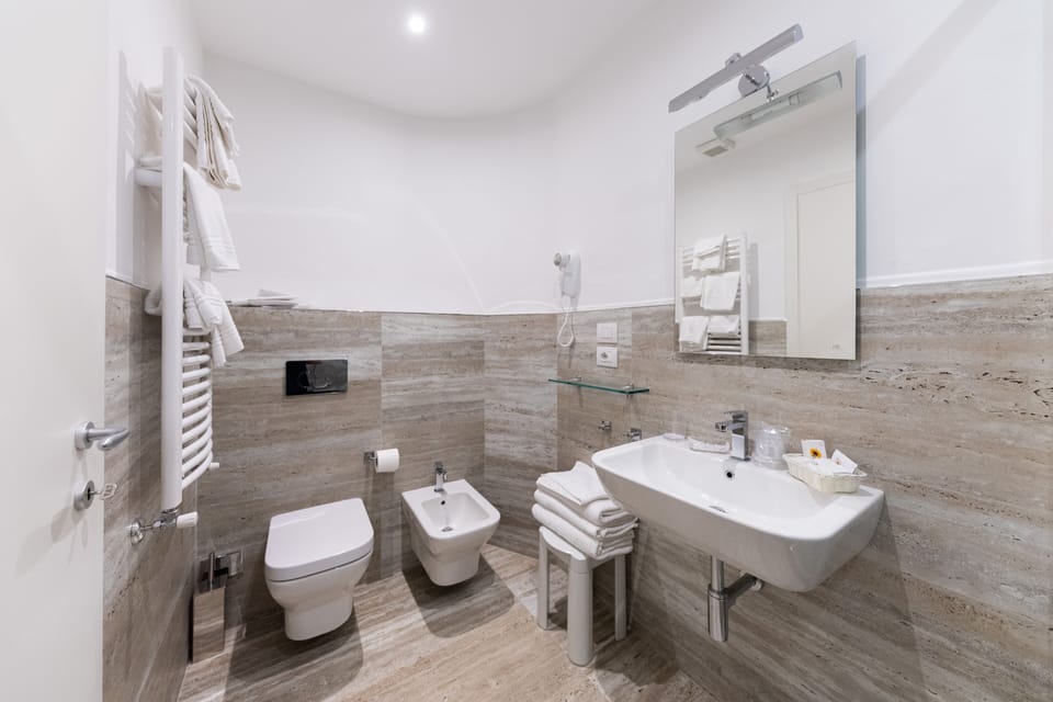 Quadruple Room, Partial Sea View | Bathroom | Free toiletries, hair dryer, slippers, bidet