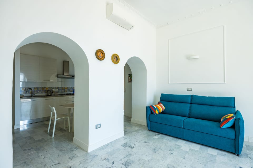 Apartment (1 Bedroom) | Living area | 32-inch Smart TV with cable channels