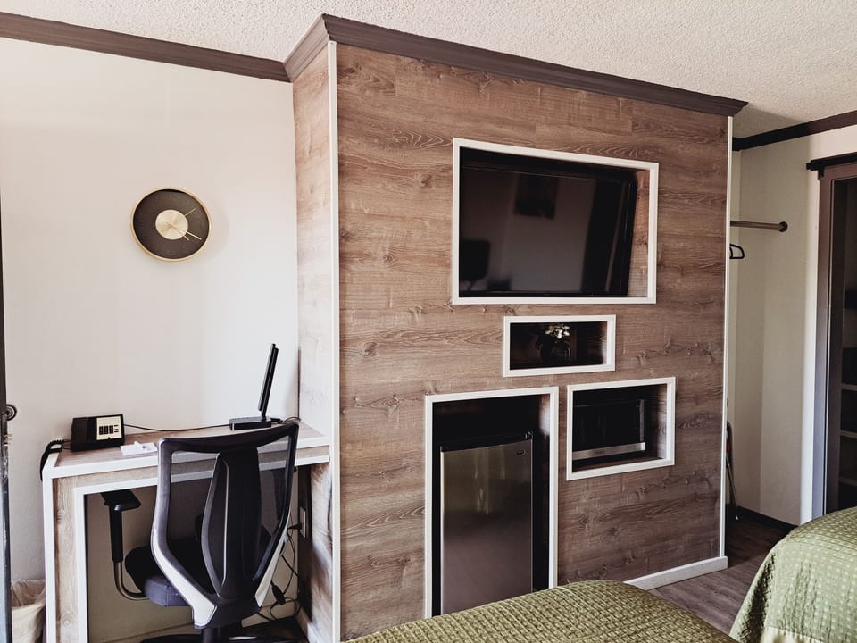 Standard Room, 2 Queen Beds | Living area | 35-inch LCD TV with cable channels, TV