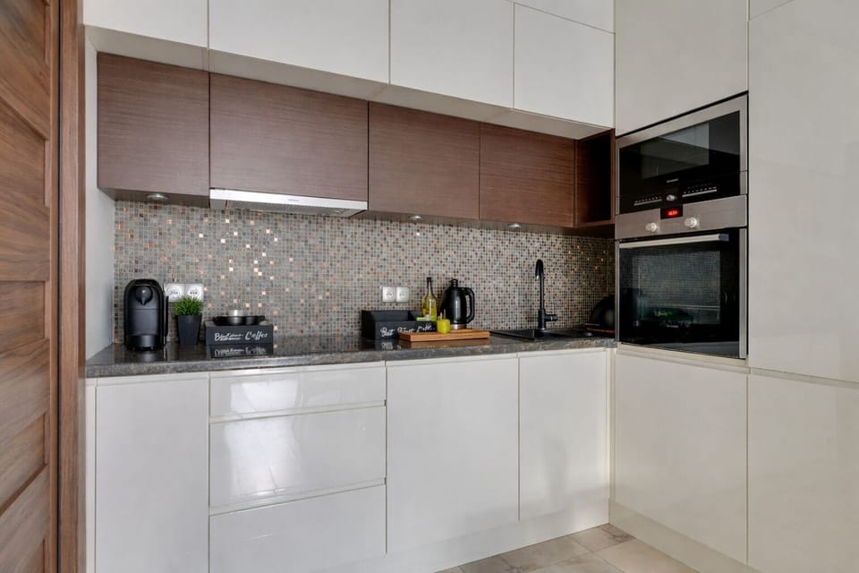 Superior Apartment, Balcony, City View | Private kitchen | Coffee/tea maker, toaster, highchair, paper towels