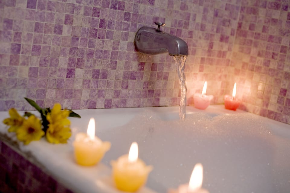 Suite | Bathroom | Bathtub, rainfall showerhead, hair dryer, bidet