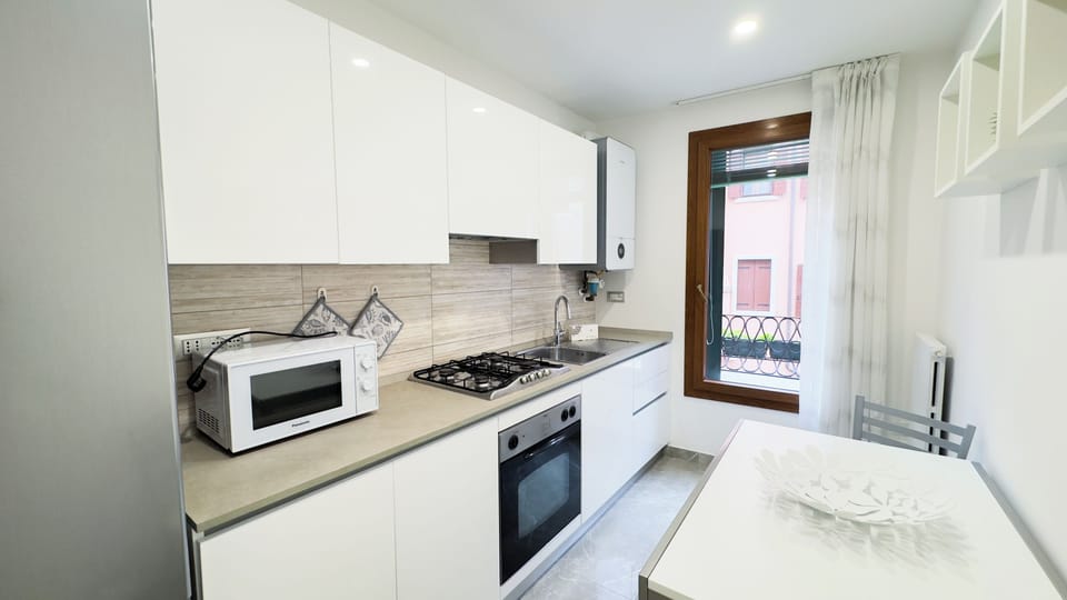 Apartment (2 Bedrooms) | Private kitchen | Espresso maker, oven, highchair